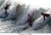 a-group-of-surfers-perform-at-la-zurriola-beach-in-san-sebastian-northern-fn3mwa.jpg