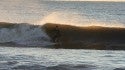 Unknown Surfer
An unknown surfer rides a clean wave