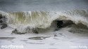 Raven Lundy in a frothy cold barrel.