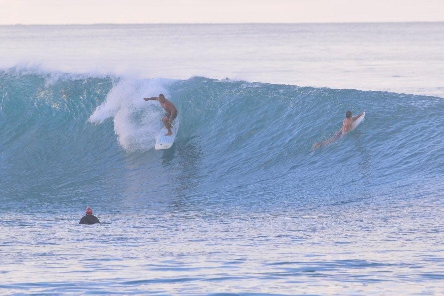Description. Kewalos, surfing photo