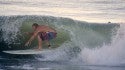 Long Board Surfer Jim Peacock ducks under the curl