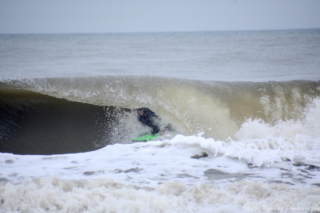Surfer Shawn Clark down low under the Wave at  The