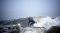 Surfer John Hammel is riding between Wave Peaks at